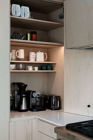 A kitchen with storage for appliances