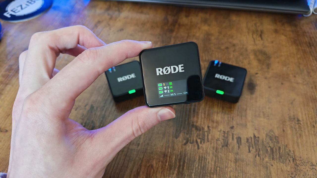 The Rode Wireless Go Gen 3 receiver held above the two transmitters