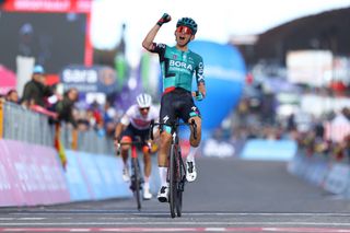 ETNA PIAZZALE RIFUGIO SAPIENZA ITALY MAY 10 Lennard Kmna of Germany and Team Bora Hansgrohe celebrates at finish line as stage winner ahead of Juan Pedro Lpez of Spain and Team Trek Segafredo during the 105th Giro dItalia 2022 Stage 4 a 172km stage from Avola to Etna Piazzale Rifugio Sapienza 1899m Giro WorldTour on May 10 2022 in Etna Piazzale Rifugio Sapienza Italy Photo by Michael SteeleGetty Images