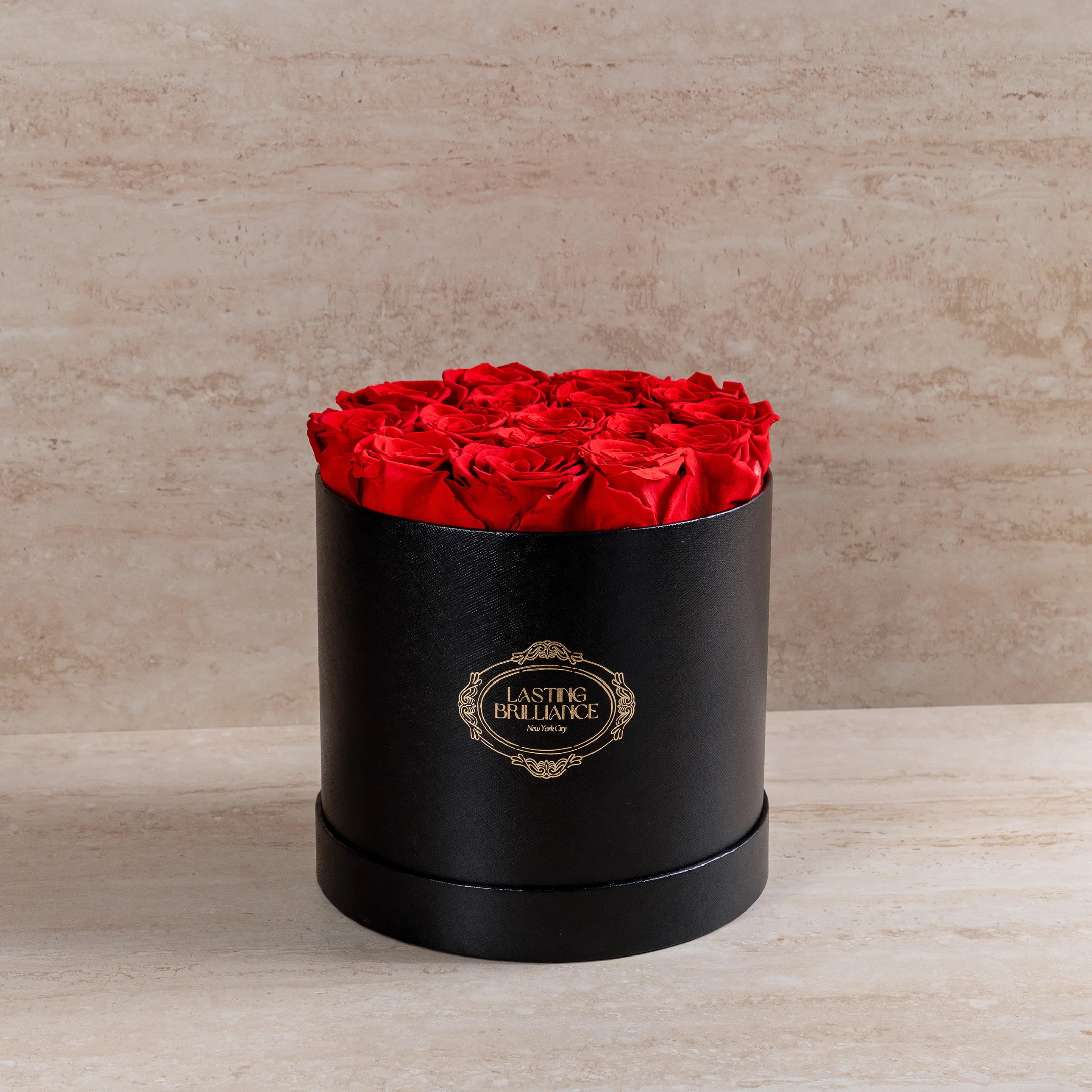 A box of Lasting Brilliance red roses