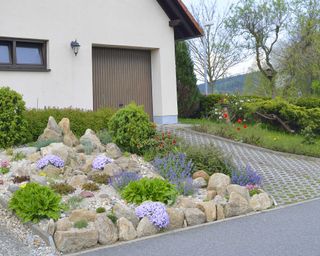 rockery garden on driveway with permeable paving