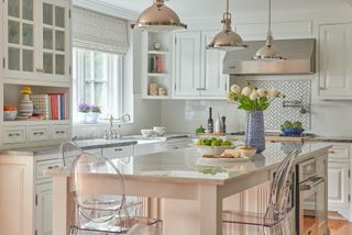 white and chrome kitchen with kitchen island, clear perspex bar stools, chrome fixtures and fittings, chrome pendants, blind