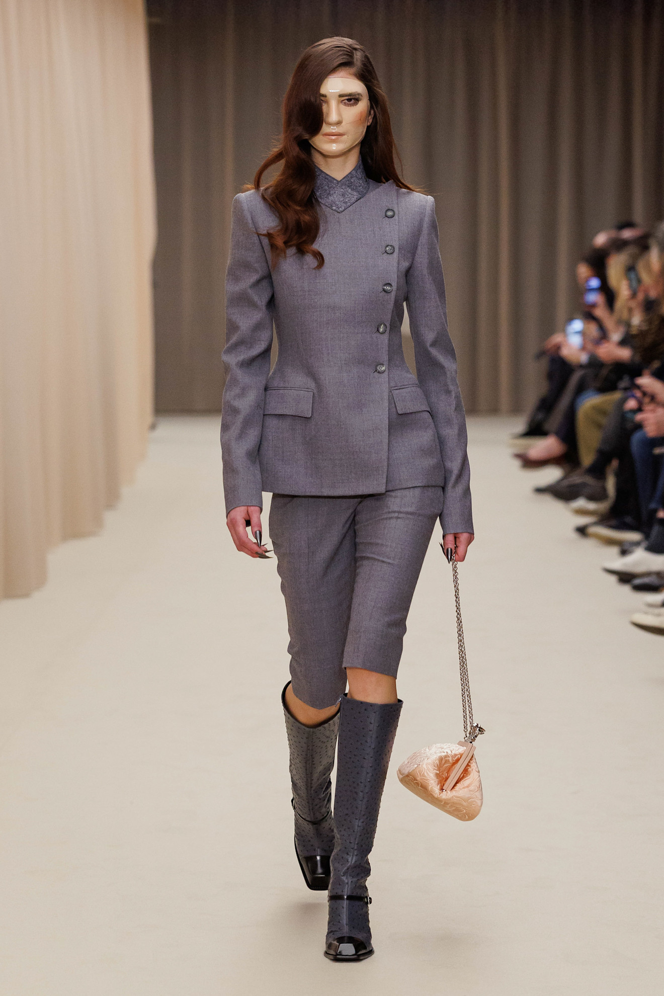 A model wore the Bermuda shorts trend on McQueen's Fall 2026 runway
