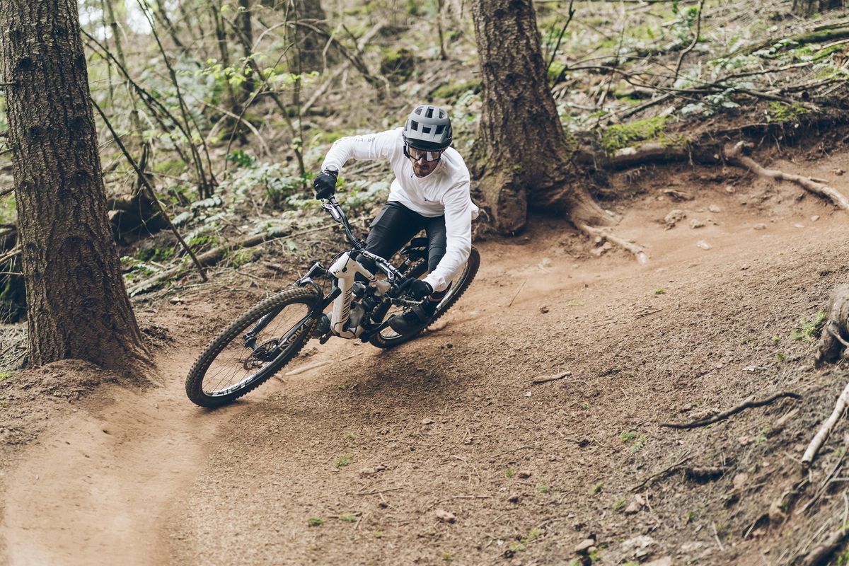 A new RockShox Flight Attendant equipped mountain bike being ridden down a trail