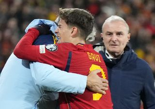 Gavi is helped off the field after suffering a serious injury playing for Spain against Georgia in November 2023.