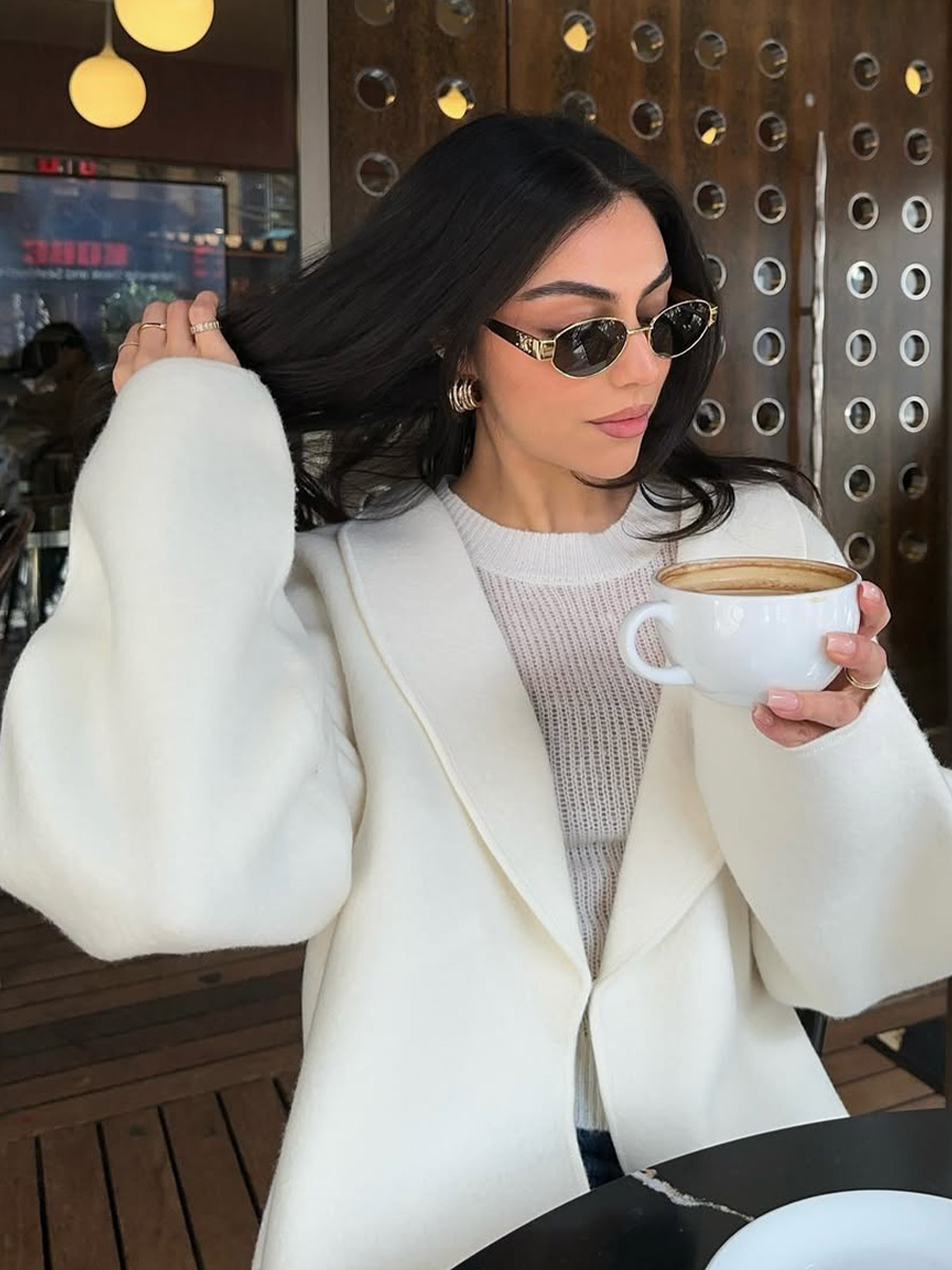 Mobina Peiman drinks tea with ultra-glossy black strands.