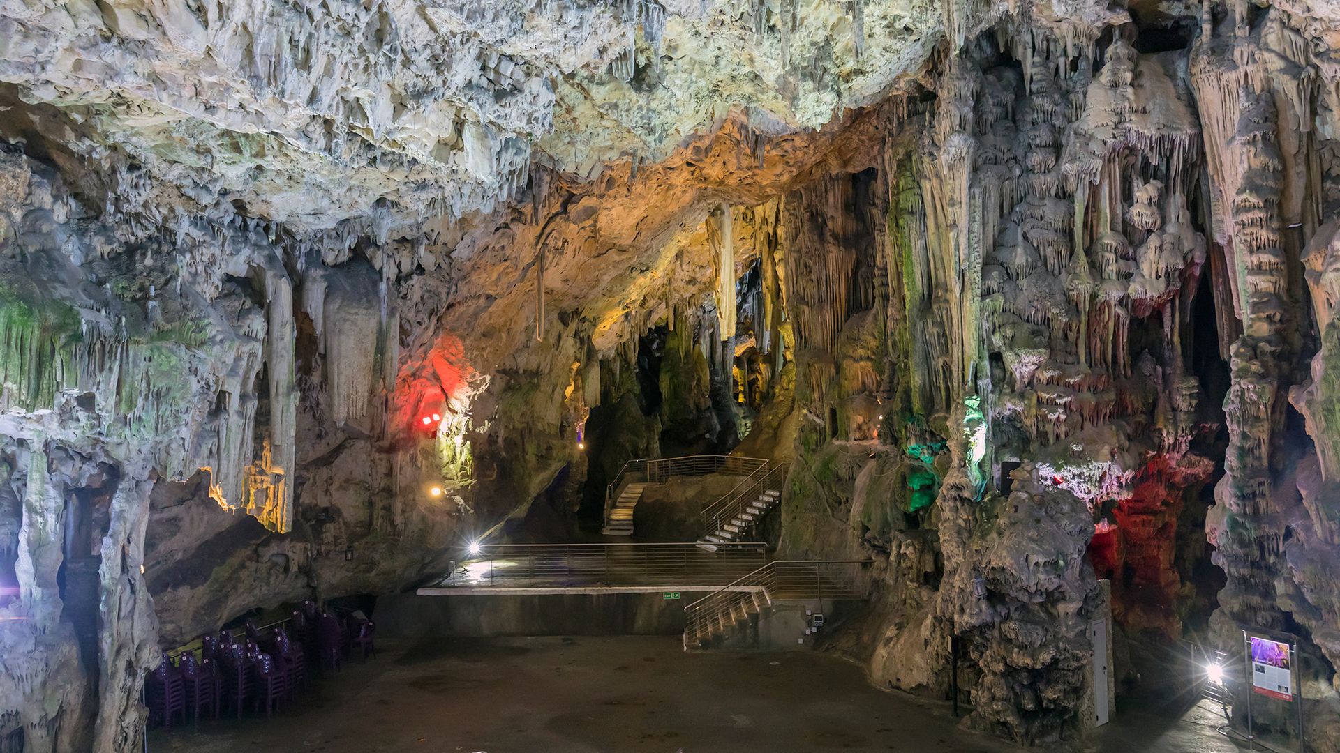A look inside a cave with lots of rock formations.