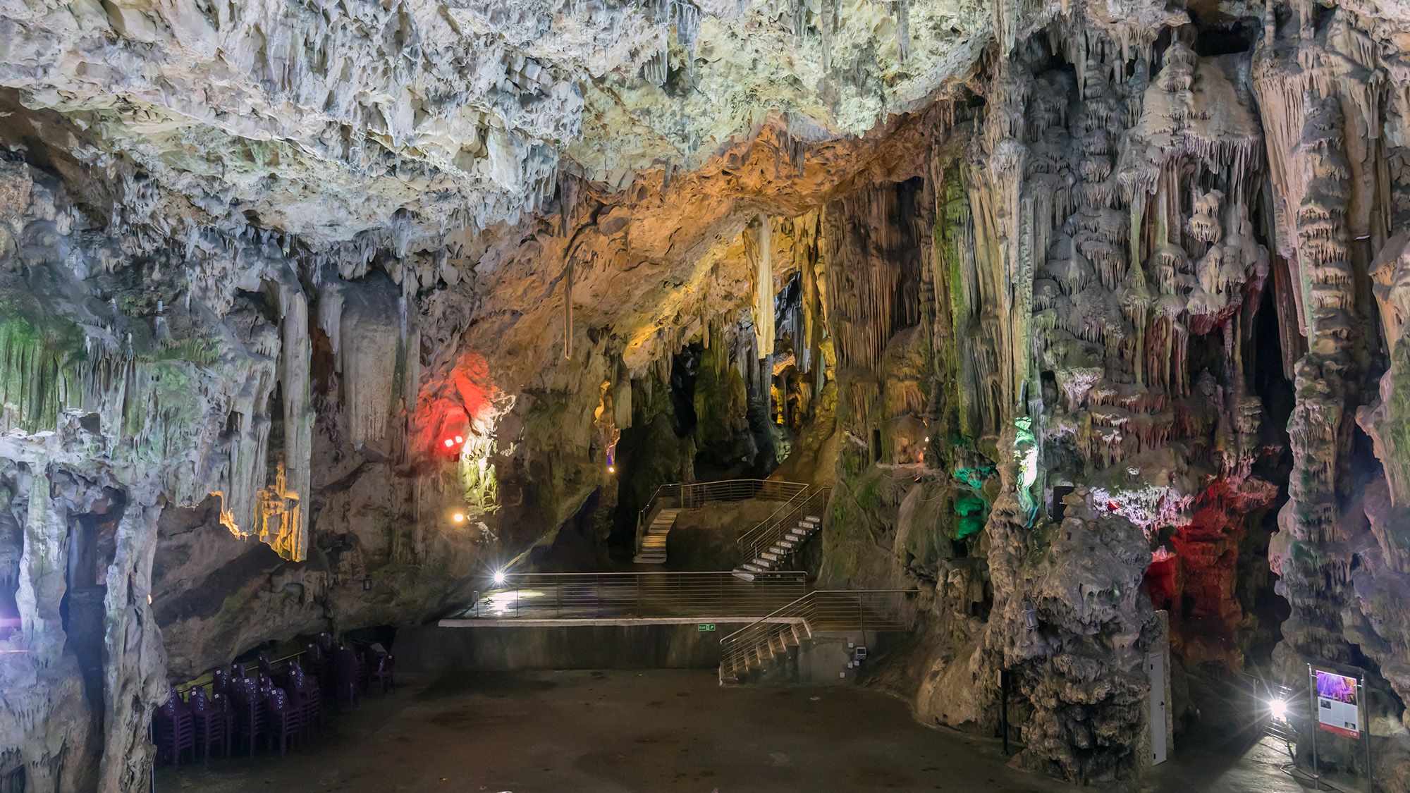 A look inside a cave with lots of rock formations.