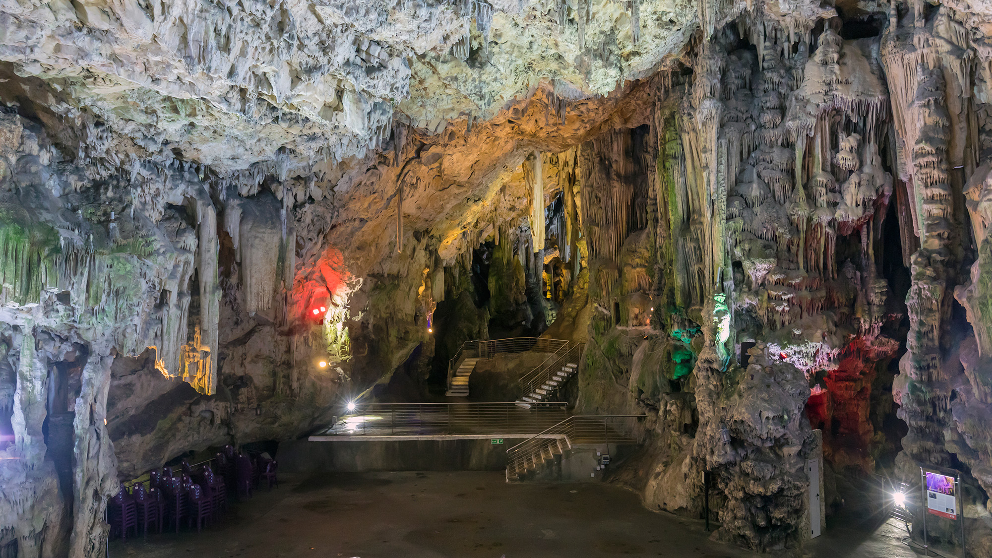 A look inside a cave with lots of rock formations.