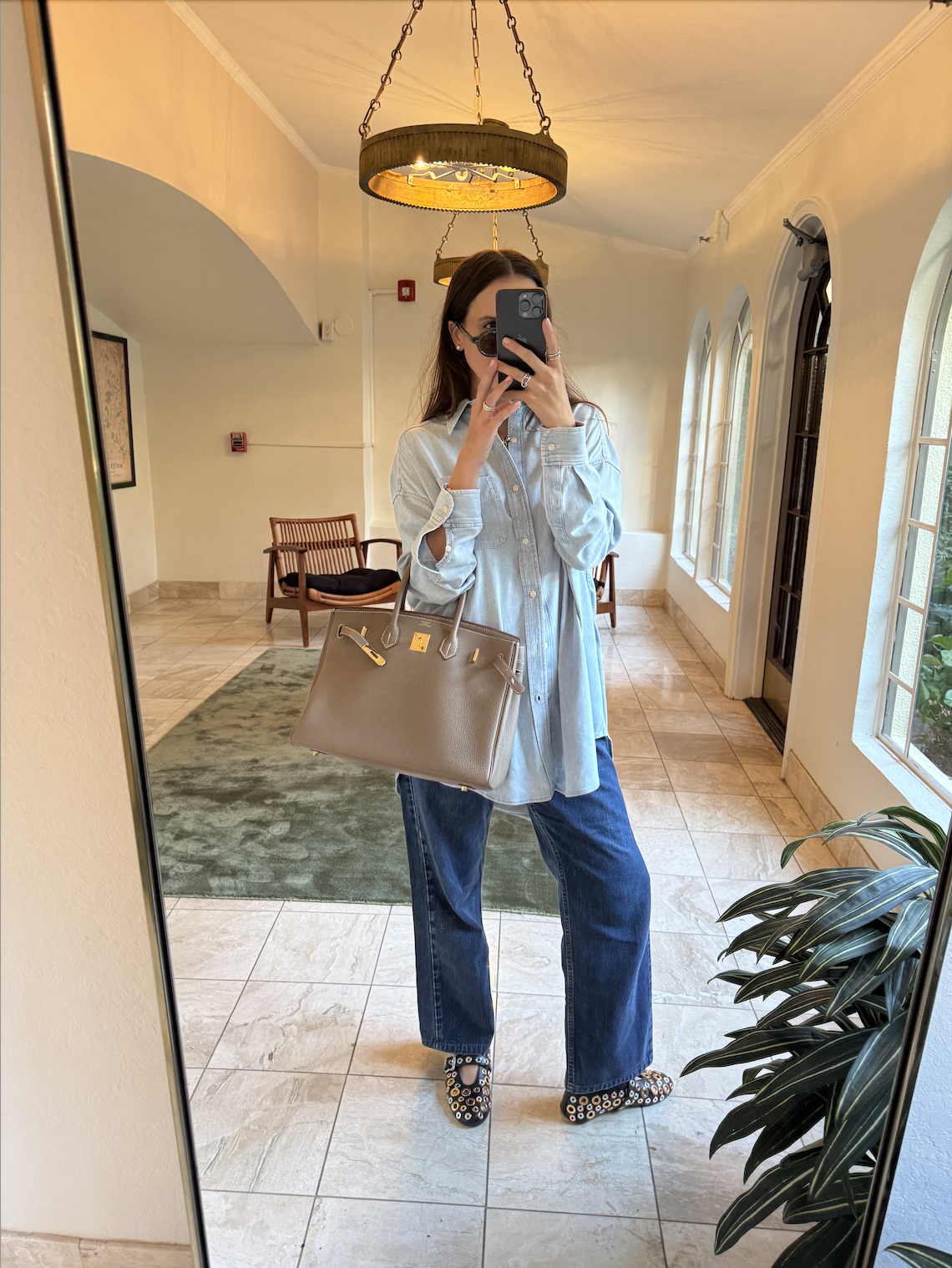 Rachel Whitehouse wears button down shirt, jeans, flats in mirror selfie