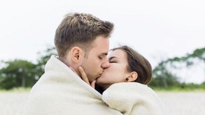 couple kissing on beach