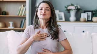 Woman breathing in deeply