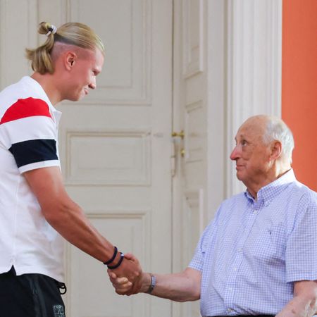Erling Haaland shaking hands with King Harald