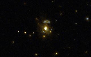 This image taken with the NASA/ESA Hubble Space Telescope shows the galaxy 3C 297, which was part of a large survey of galaxies that sought to confirmed the link between mergers and galaxies hosting relativistic jets from supermassive black holes.