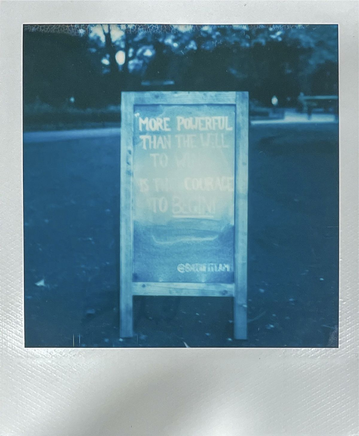Polaroid loves as inspirational quote. "More powerful than the will to win is the courage to begin."