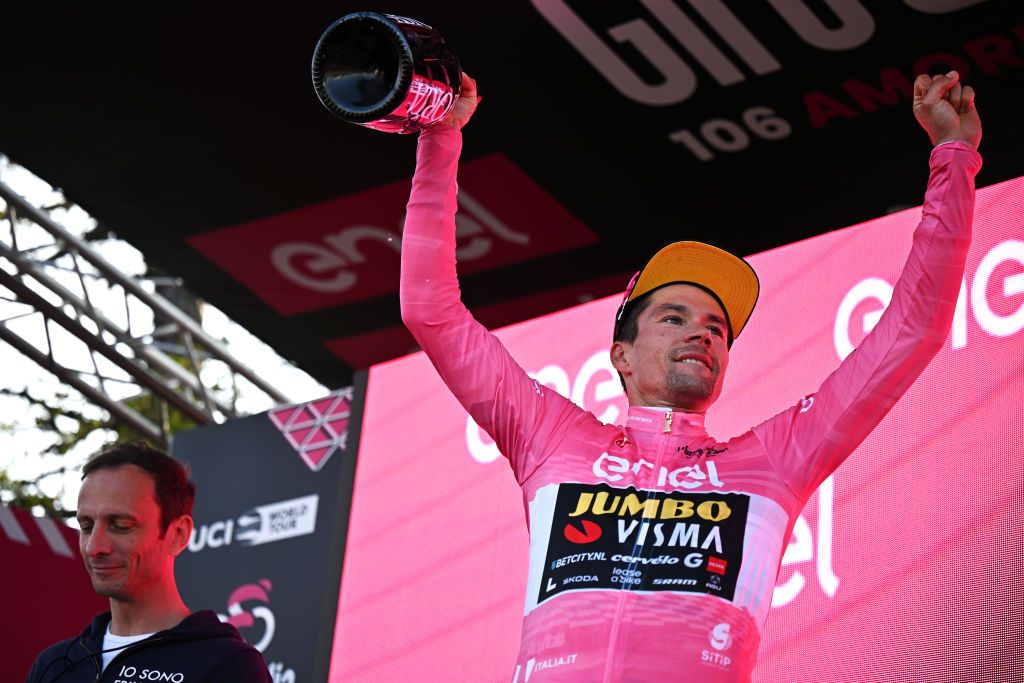 MONTE LUSSARI ITALY MAY 27 Primo Rogli of Slovenia and Team JumboVisma celebrates at podium as Pink Leader Jersey winner during the 106th Giro dItalia 2023 Stage 20 a 186km individual climbing time trial stage from Tarvisio 750m to Monte Lussari 1744m UCIWT on May 27 2023 in Monte Lussari Italy Photo by Stuart FranklinGetty Images
