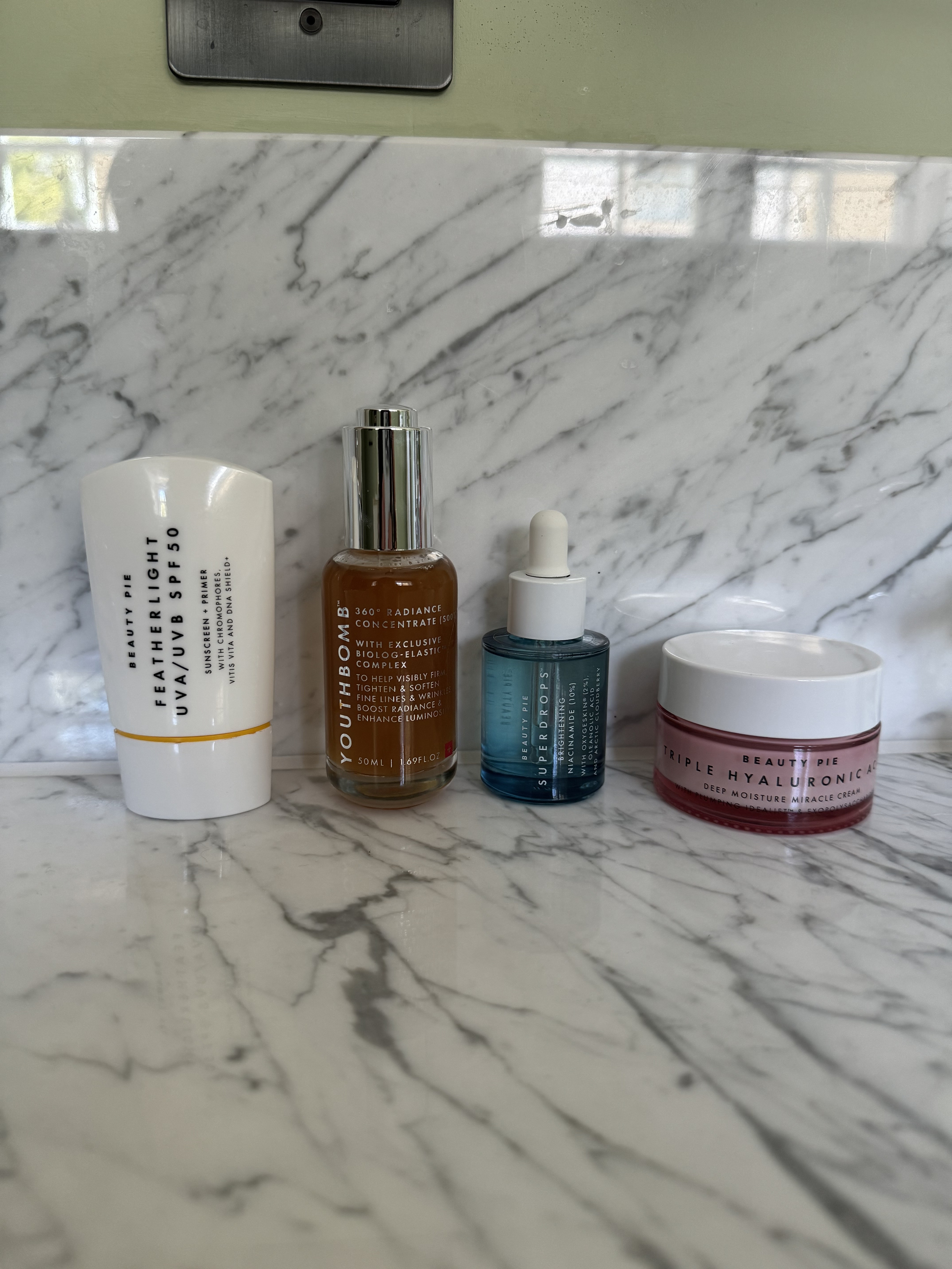 Beauty Pie skincare, including the Featherlight SPF, Youthbomb serum, niacinamide serum and triple hyaluronic acid moisturiser