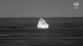A thermal image showing the Crew 7 Dragon capsule floating ibn the sea off the coast of Pennsicola Florida on March 12