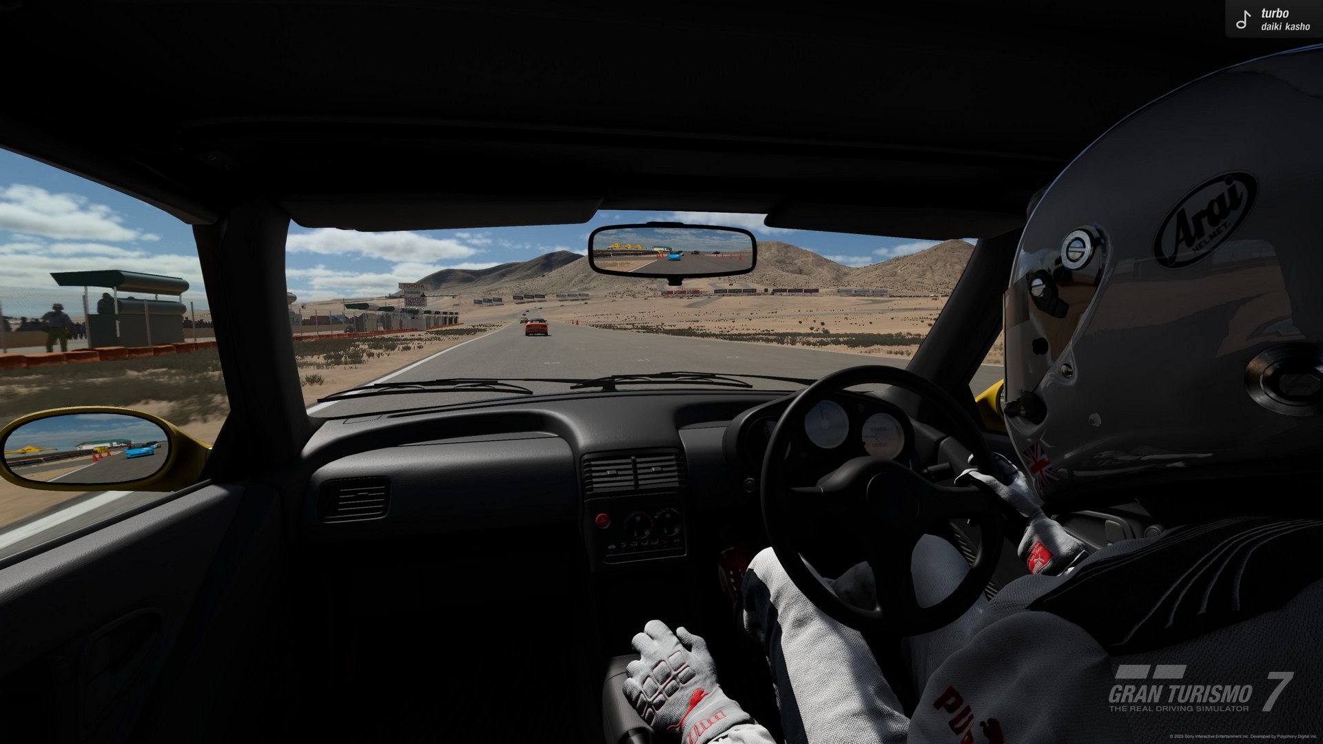 An over the shoulder view of a desert race in Gran Turismo 7