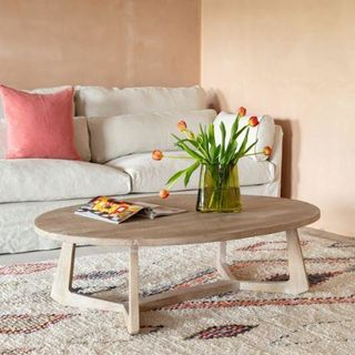 brown coffee table on rug