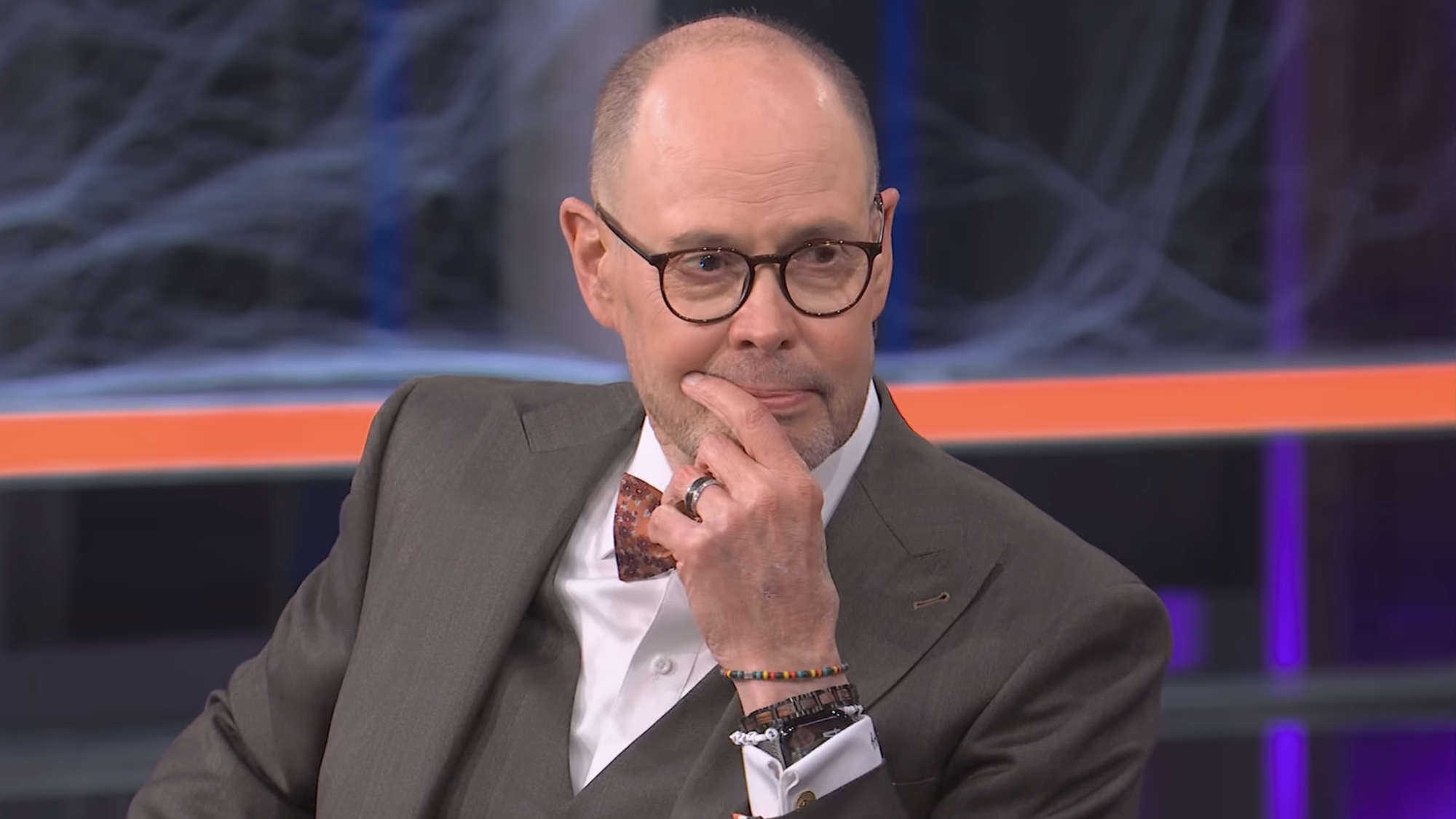 Ernie Johnson looks emotional as he listens to Charles Barkley pay tribute to him on Inside the NBA.