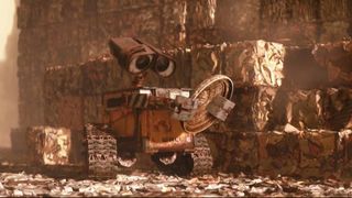 WALL-E staring at himself in a garbage lid in WALL-E