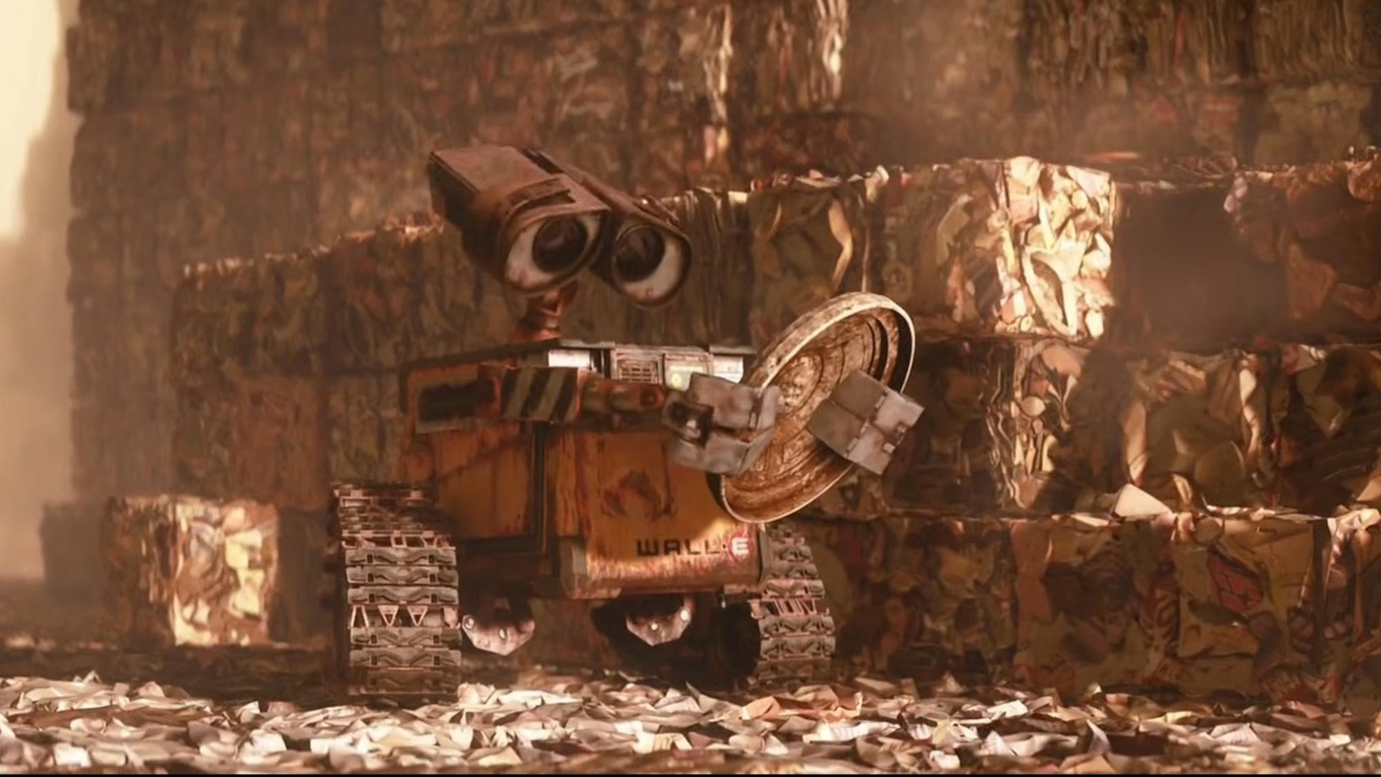 WALL-E staring at himself in a garbage lid in WALL-E