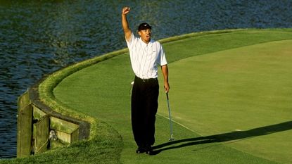 Tiger Woods celebrates making his “Better than most” putt at the 17th hole during the third round of The PLAYERS Championship at the TPC Stadium course on March 24, 2001