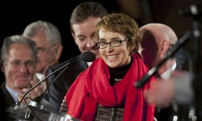 Rep. Gabrielle Giffords (D-Ariz.) smiled after reciting the Pledge of Allegiance at a memorial service Sunday that marked the anniversary of last year's deadly Tucson shooting.