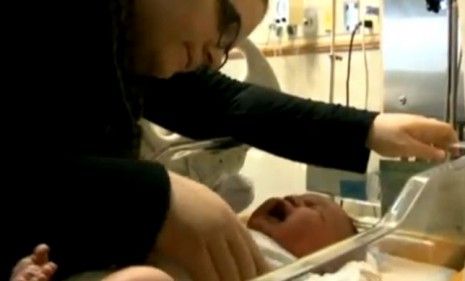 The 12.5 pound Baby Jordan, here with by his mother, was expected to top out at 11 pounds.