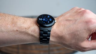 The Google Pixel Watch with the official metal band in matte black
