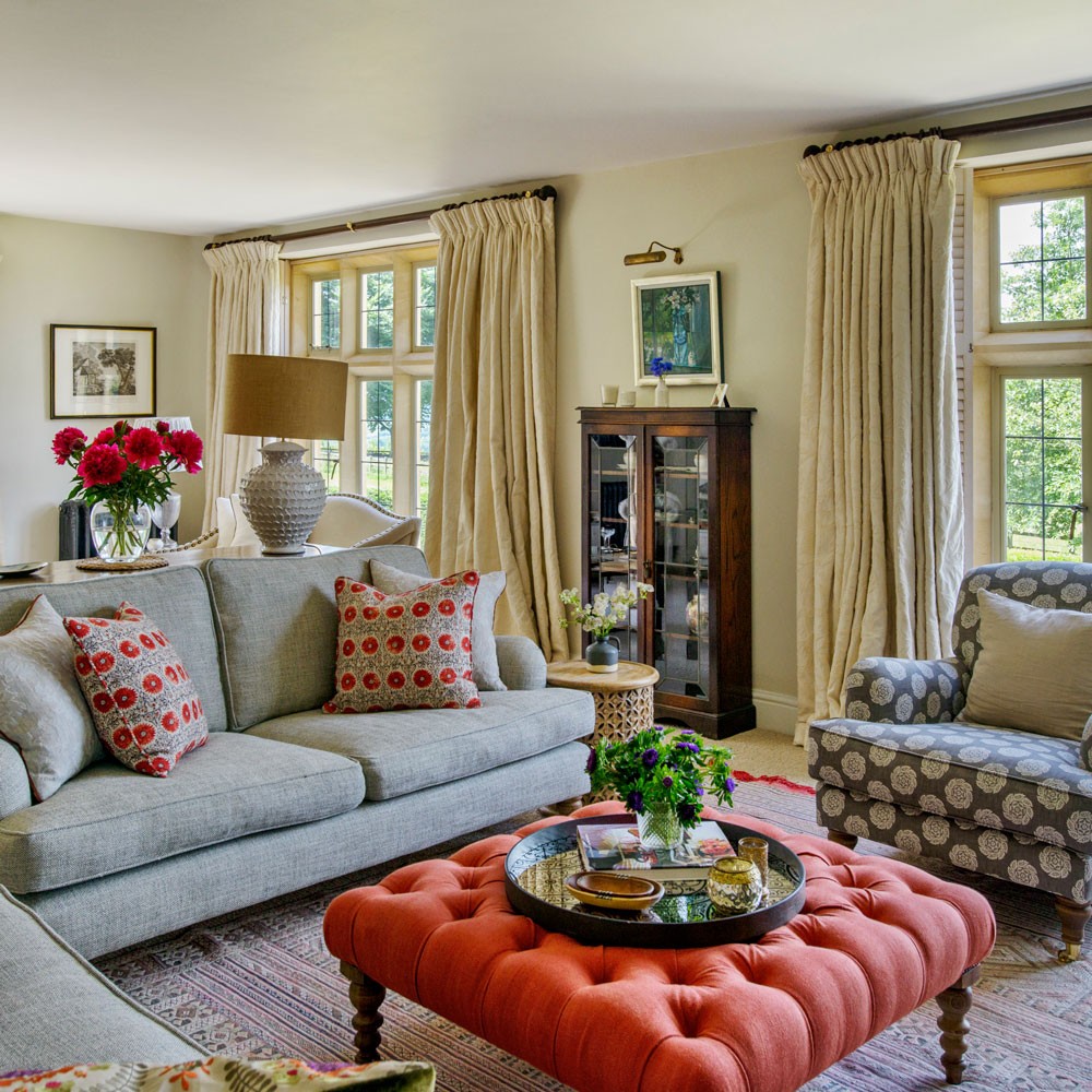 living room with large windows and sofa set