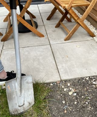 Contributor Kate Sandhu using metal spade in backyard