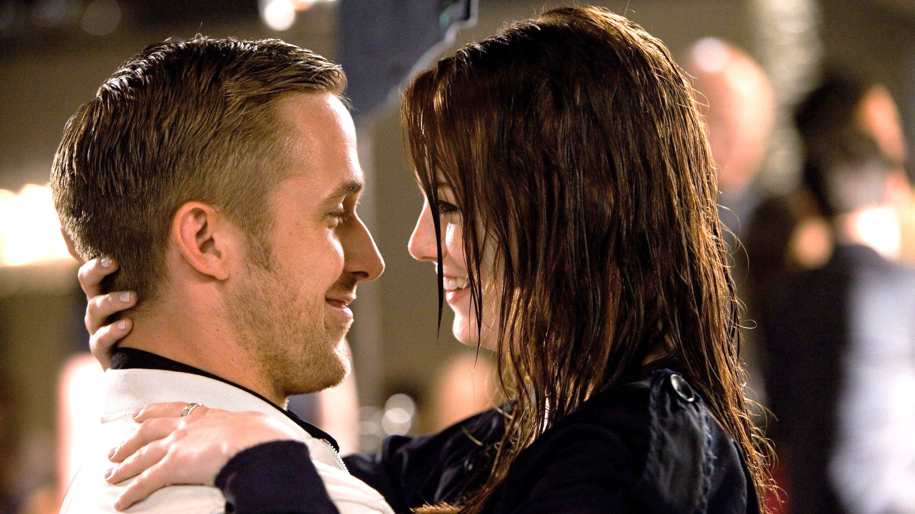 L-R: Ryan Gosling and Emma Stone seen side-on embracing in a scene from "Crazy, Stupid, Love"