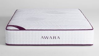 Best organic mattress: image shows the Awara Natural Hybrid Mattress in white with red piping around the edges