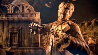 Civilization 7: a screenshot of a bronze man playing the violin during the trailer for Civilization 7.