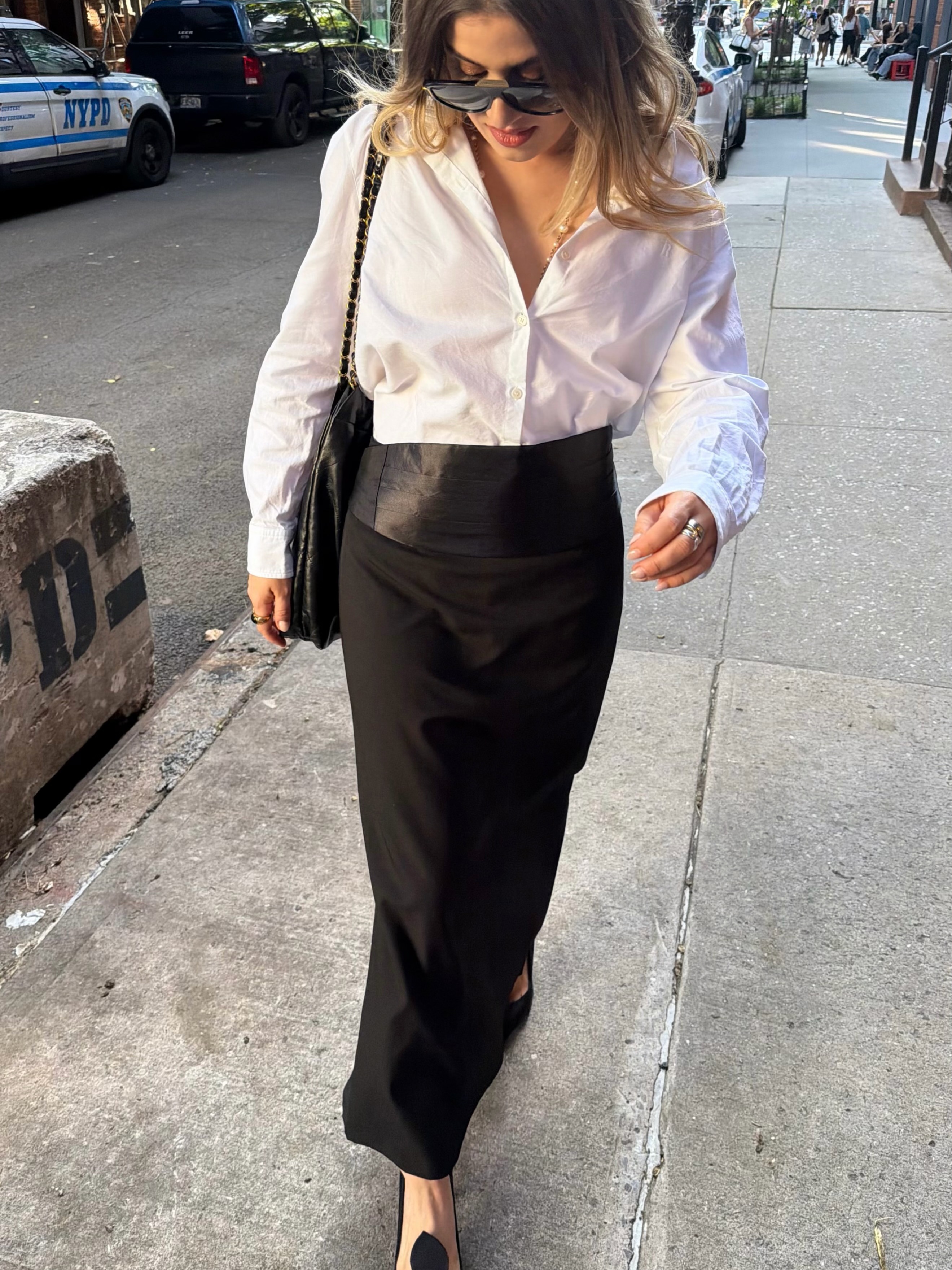 Influencer wearing button-down shirt outfit.