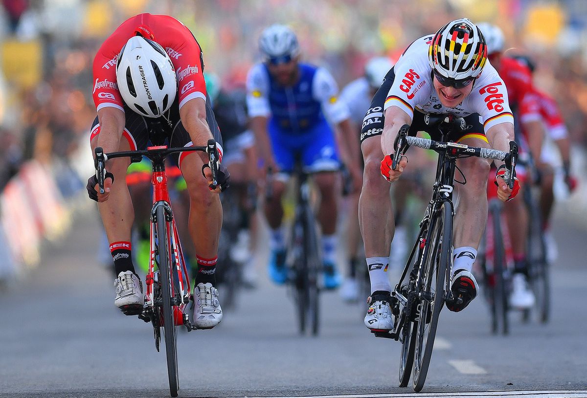 John Degenkolb (Trek-Segafredo) and Andre Greipel (Lotto Soudal) lunge for the line