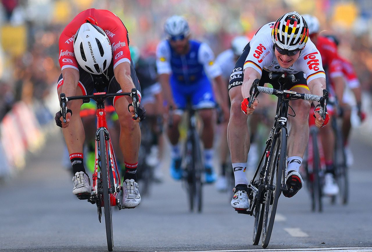John Degenkolb (Trek-Segafredo) and Andre Greipel (Lotto Soudal) lunge for the line