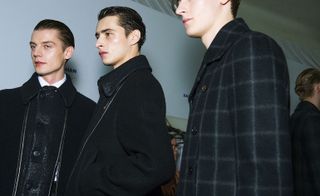Three male models with black jackets on