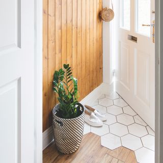 White hexagon and wood flooring in hallway