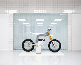 electric motorbike in white space inside CAKE HQ, Venice, California, by Shin Shin Architects