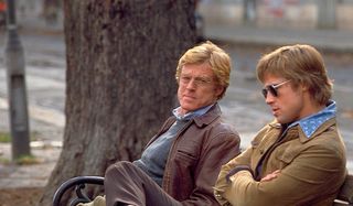 Spy Game Robert Redford on a bench with Brad Pitt