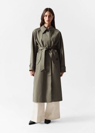 Casaco trench coat de abotoamento único