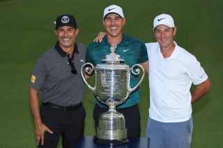 Brooks Koepka and his team with the PGA Championship trophy in 2018