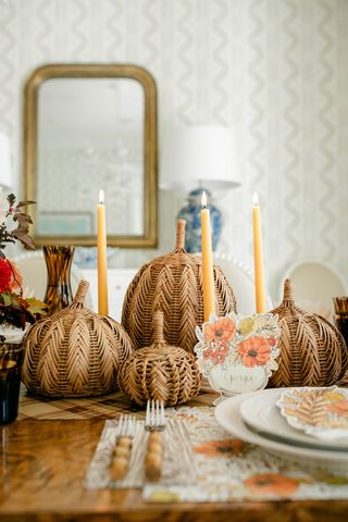 fall table decor ideas with candles and woven pumpkins