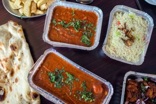 Indian food in takeaway containers