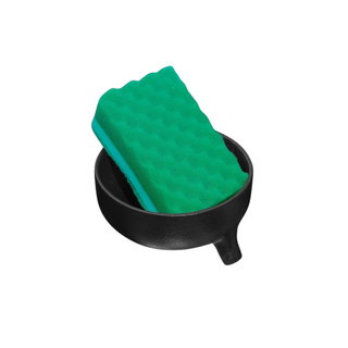 A black sponge holder with a drain