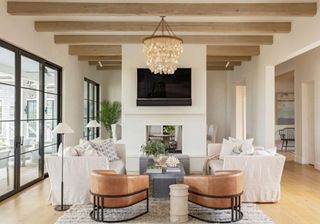 Herlong Architects and Interiors great room with partition featuring fireplacephotograph Julia Lynn Photography