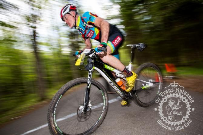 Brian Conroy speeding out of the woods to the finish.